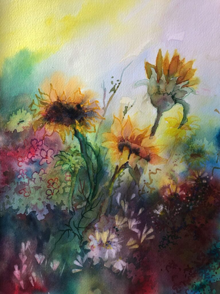 assorted flowers with prominent sunflowers